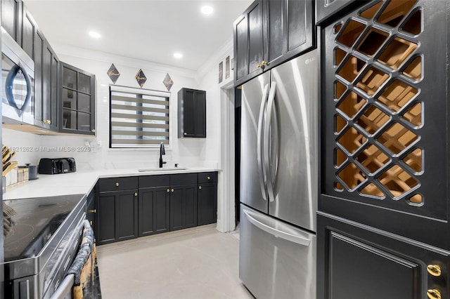 7631 Miramar Pkwy, Miramar, FL 33023 - kitchen with stainless steel appliances, dark cabinetry, crown molding, backsplash, and recessed lighting