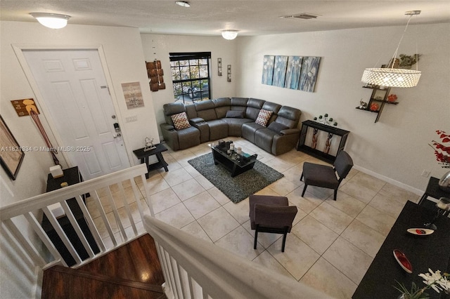3507 W 89th Pl, Hialeah, FL 33018 - living area featuring light tile patterned floors and baseboards