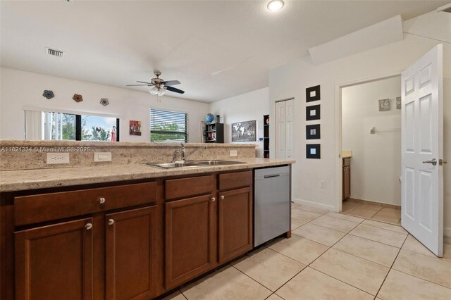 3507 W 89th Pl, Hialeah, FL 33018 - kitchen with stainless steel dishwasher, ceiling fan, light tile patterned flooring, and light stone counters