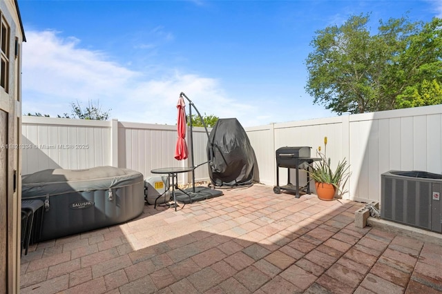 3507 W 89th Pl, Hialeah, FL 33018 - fenced backyard featuring a patio, a hot tub, and a grill