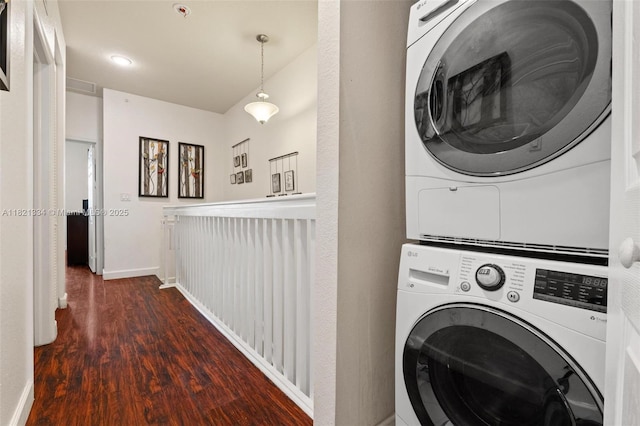 3507 W 89th Pl, Hialeah, FL 33018 - washroom with stacked washer and clothes dryer and wood finished floors