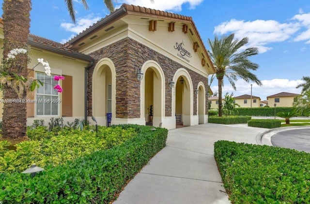 3507 W 89th Pl, Hialeah, FL 33018 - view of front of property with stucco siding, stone siding, and a tile roof