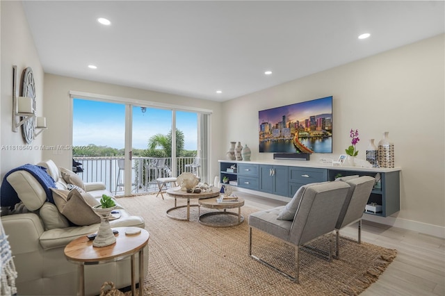 4034 N Ocean Dr, Hollywood, FL 33019 - living room featuring light wood-type flooring and recessed lighting