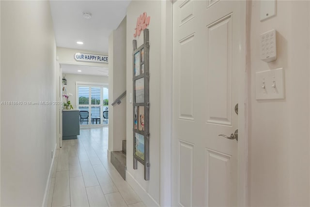 4034 N Ocean Dr, Hollywood, FL 33019 - corridor with light tile patterned floors and recessed lighting