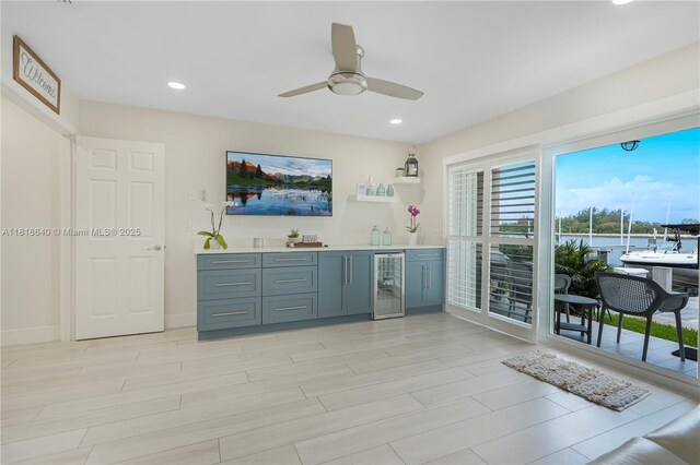 4034 N Ocean Dr, Hollywood, FL 33019 - indoor wet bar with wine cooler, ceiling fan, light wood-style flooring, and recessed lighting