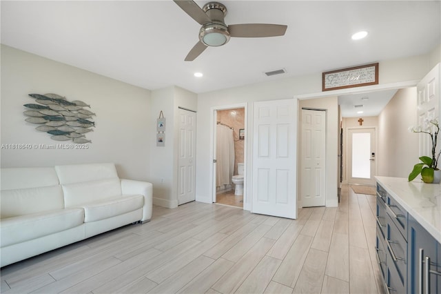 4034 N Ocean Dr, Hollywood, FL 33019 - living area with light wood-type flooring, ceiling fan, and recessed lighting