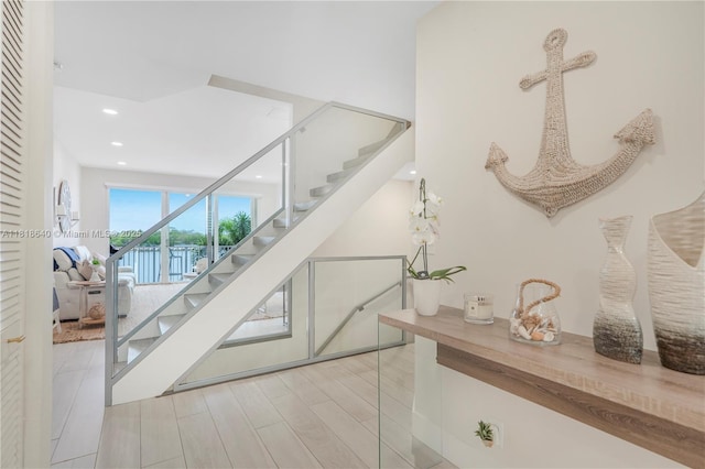 4034 N Ocean Dr, Hollywood, FL 33019 - staircase featuring recessed lighting and wood finished floors