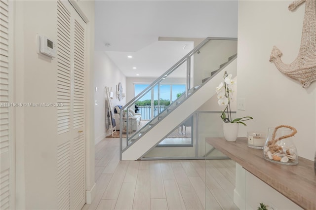 4034 N Ocean Dr, Hollywood, FL 33019 - staircase featuring recessed lighting and baseboards