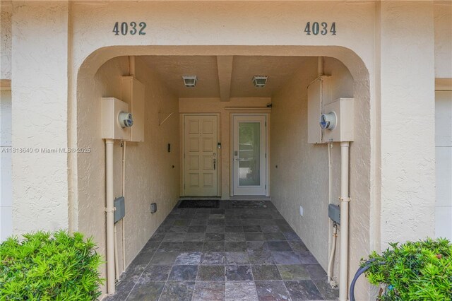 4034 N Ocean Dr, Hollywood, FL 33019 - garage featuring a garage door opener and a textured wall