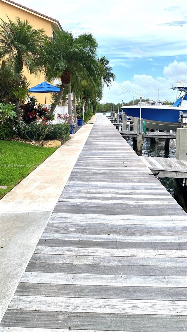 4034 N Ocean Dr, Hollywood, FL 33019 - dock featuring boat lift and a water view