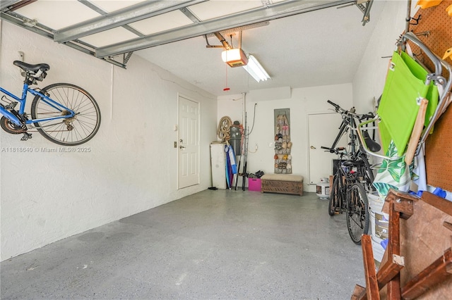 4034 N Ocean Dr, Hollywood, FL 33019 - garage with a garage door opener and a textured wall
