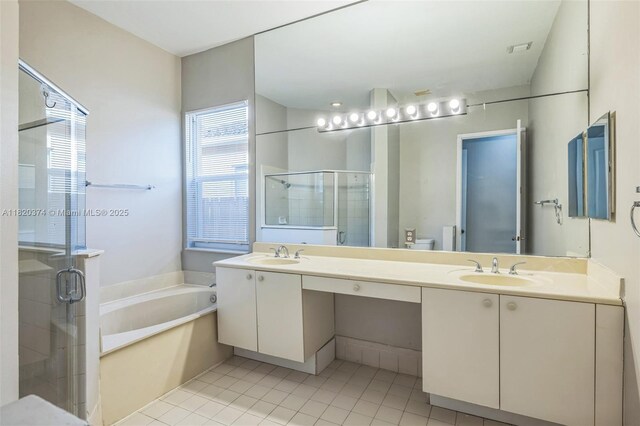 1951 NE 3rd Ct, Homestead, FL 33033 - bathroom featuring a garden tub, a stall shower, double vanity, and tile patterned flooring