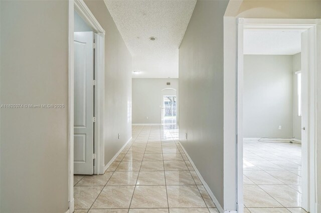 1951 NE 3rd Ct, Homestead, FL 33033 - hall featuring a textured ceiling and arched walkways