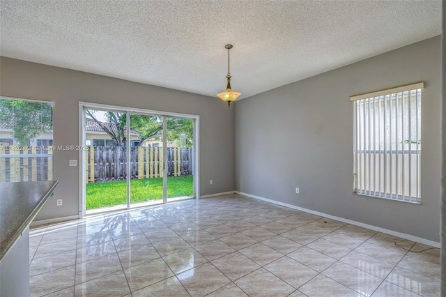 1951 NE 3rd Ct, Homestead, FL 33033 - empty room with a textured ceiling and baseboards