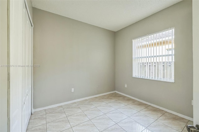 1951 NE 3rd Ct, Homestead, FL 33033 - unfurnished room featuring baseboards and light tile patterned flooring