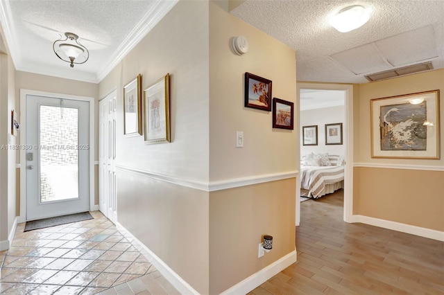 4311 NW 16th St Unit B103, Lauderhill, FL 33313 - entryway with a textured ceiling, plenty of natural light, light wood finished floors, and crown molding