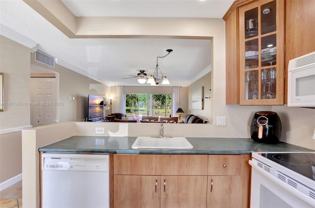 4311 NW 16th St Unit B103, Lauderhill, FL 33313 - kitchen featuring white appliances, open floor plan, ornamental molding, dark countertops, and light brown cabinetry