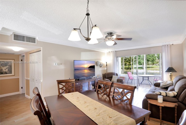 4311 NW 16th St Unit B103, Lauderhill, FL 33313 - dining area with a textured ceiling, ornamental molding, a ceiling fan, and light wood-style flooring