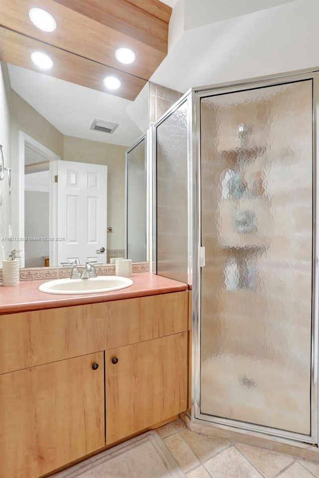 4311 NW 16th St Unit B103, Lauderhill, FL 33313 - bathroom with a stall shower, vanity, recessed lighting, and tile patterned floors