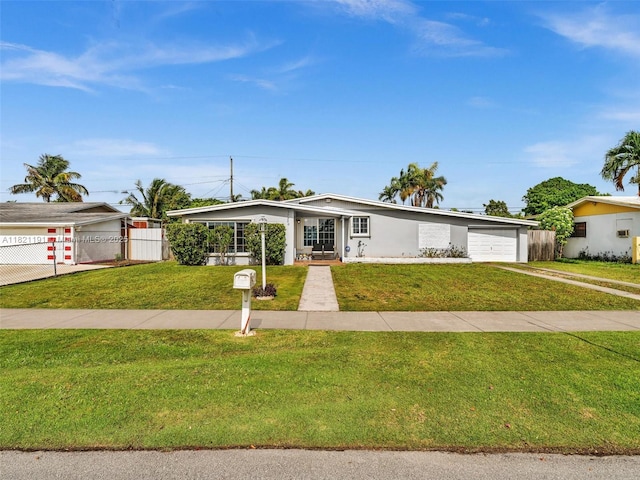17320 SW 117th Ave, Miami, FL 33177 - mid-century modern home featuring concrete driveway, a garage, and stucco siding