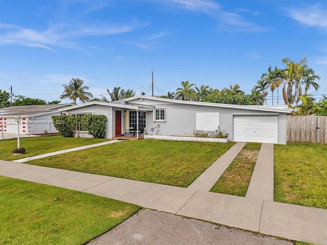 17320 SW 117th Ave, Miami, FL 33177 - view of front of house with concrete driveway, an attached garage, and stucco siding