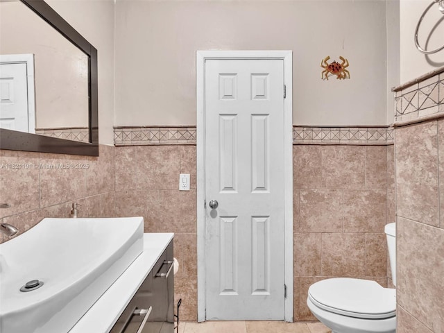 17320 SW 117th Ave, Miami, FL 33177 - bathroom with tile walls, wainscoting, vanity, and tile patterned flooring