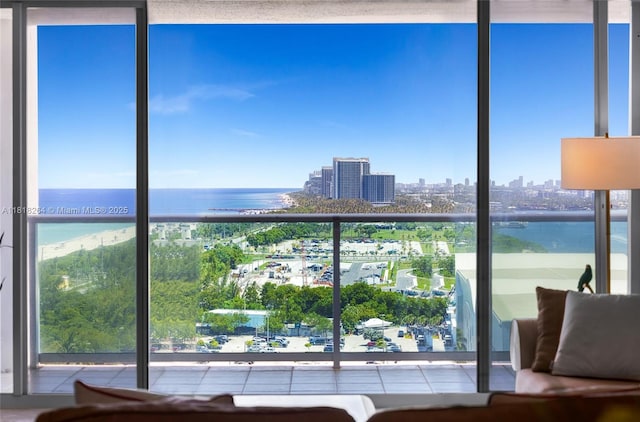 100 Bayview Dr Unit 1922, Sunny Isles Beach, FL 33160 - sitting room featuring a city view, a water view, expansive windows, and tile patterned flooring