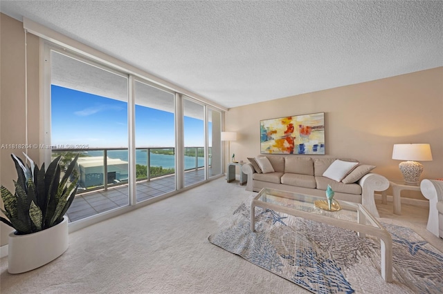 100 Bayview Dr Unit 1922, Sunny Isles Beach, FL 33160 - carpeted living room with expansive windows, a water view, and a textured ceiling