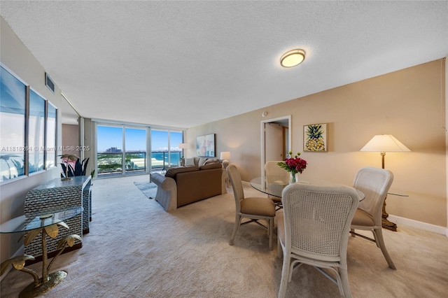 100 Bayview Dr Unit 1922, Sunny Isles Beach, FL 33160 - dining room with light colored carpet and a textured ceiling