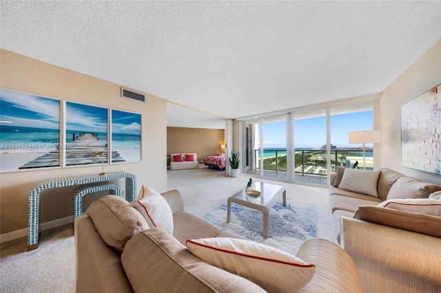 100 Bayview Dr Unit 1922, Sunny Isles Beach, FL 33160 - carpeted living room with a textured ceiling and a wall of windows