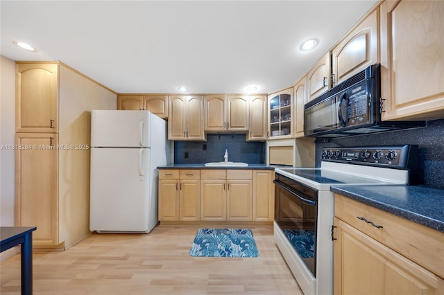 100 Bayview Dr Unit 1922, Sunny Isles Beach, FL 33160 - kitchen with white appliances, light brown cabinets, dark countertops, light wood-style floors, and recessed lighting