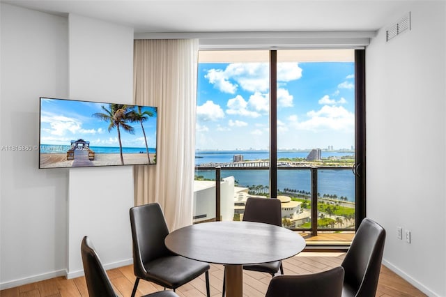 398 NE 5th St Unit 1809, Miami, FL 33132 - dining area with light wood-style floors, healthy amount of natural light, and floor to ceiling windows