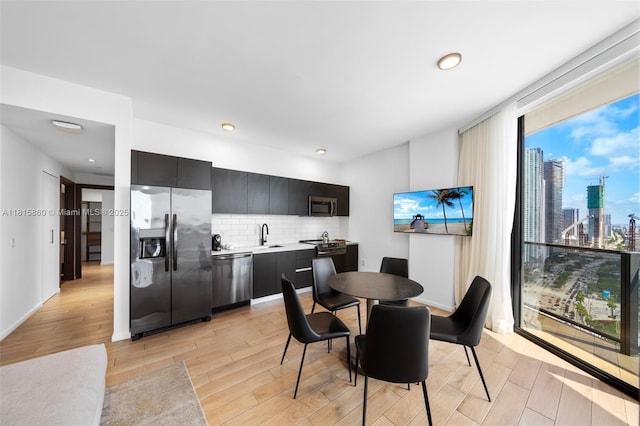 398 NE 5th St Unit 1809, Miami, FL 33132 - dining area with light wood-type flooring and recessed lighting