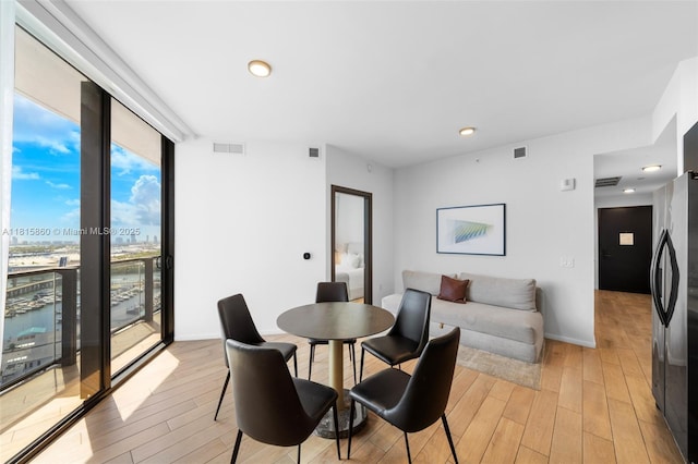 398 NE 5th St Unit 1809, Miami, FL 33132 - dining space featuring light wood finished floors and recessed lighting