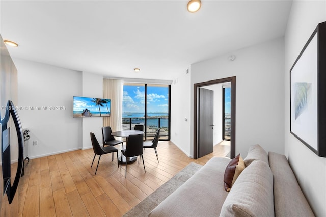 398 NE 5th St Unit 1809, Miami, FL 33132 - dining space featuring light wood-type flooring and a wall of windows