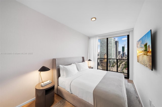 398 NE 5th St Unit 1809, Miami, FL 33132 - bedroom featuring wood finished floors and baseboards
