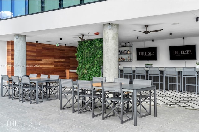 398 NE 5th St Unit 1809, Miami, FL 33132 - view of patio featuring outdoor dining space, a ceiling fan, and a bar