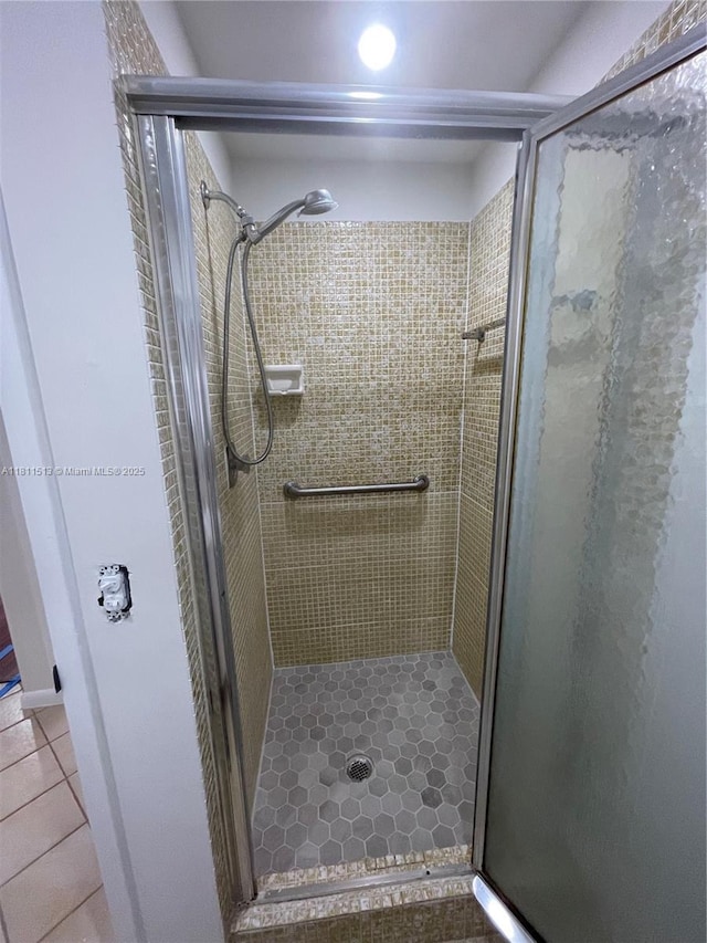 413 Saxony I Unit 413, Delray Beach, FL 33446 - bathroom featuring a shower stall and tile patterned flooring