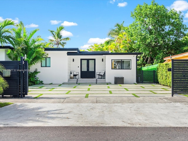 4531 SW 15th St, Miami, FL 33134 - view of front of home with french doors and stucco siding