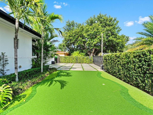4531 SW 15th St, Miami, FL 33134 - fenced backyard featuring a putting area and a patio area