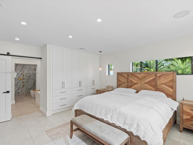 4531 SW 15th St, Miami, FL 33134 - bedroom featuring a barn door, recessed lighting, and light tile patterned floors