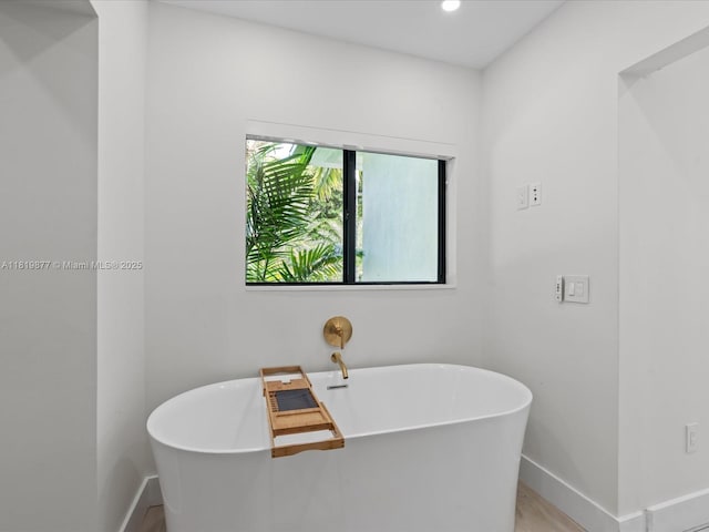 4531 SW 15th St, Miami, FL 33134 - full bathroom with a freestanding bath, wood finished floors, and recessed lighting