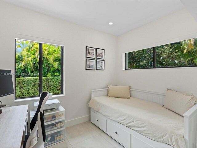 4531 SW 15th St, Miami, FL 33134 - bedroom with light tile patterned floors and baseboards