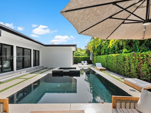 4531 SW 15th St, Miami, FL 33134 - view of pool with a fenced backyard, a pool with connected hot tub, and a patio