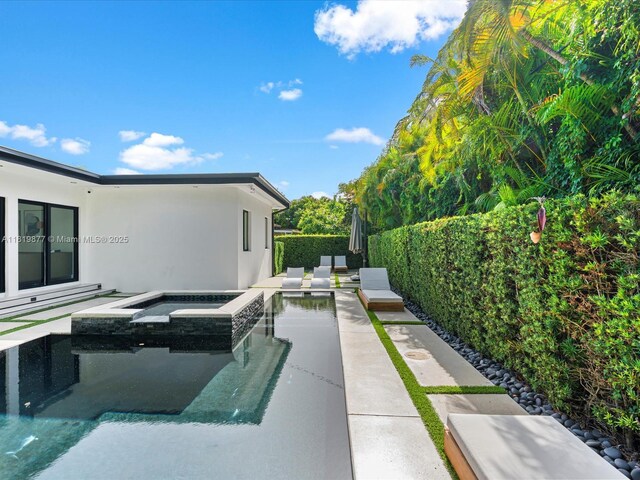 4531 SW 15th St, Miami, FL 33134 - fenced backyard with a pool with connected hot tub