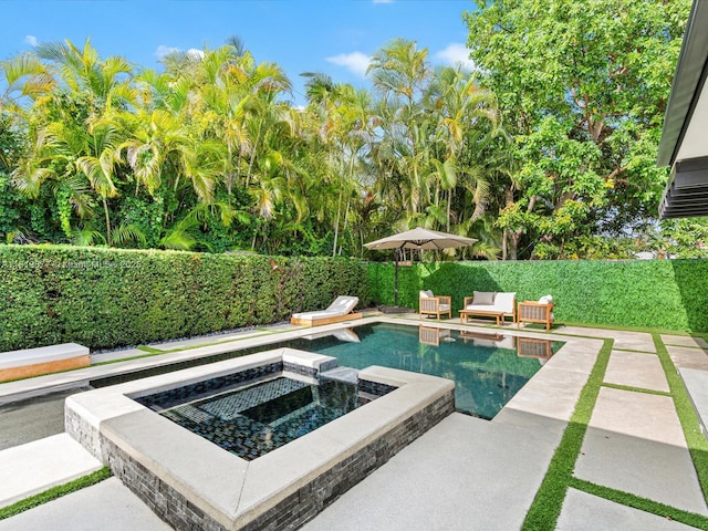 4531 SW 15th St, Miami, FL 33134 - view of pool with an in-ground hot tub, a fenced backyard, and a patio