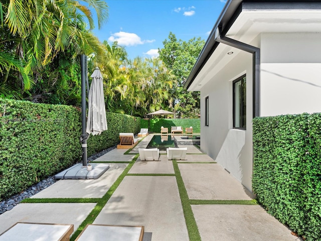4531 SW 15th St, Miami, FL 33134 - fenced backyard featuring a patio area and outdoor lounge area
