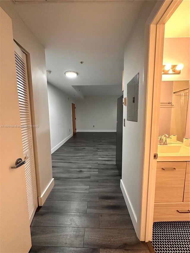 1542 Drexel Ave Unit 107, Miami Beach, FL 33139 - hall featuring electric panel and dark wood finished floors