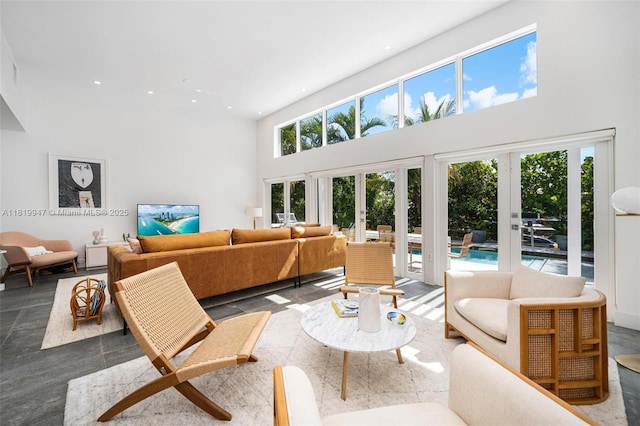 7755 Noremac Ave, Miami Beach, FL 33141 - living area with a high ceiling, recessed lighting, and french doors