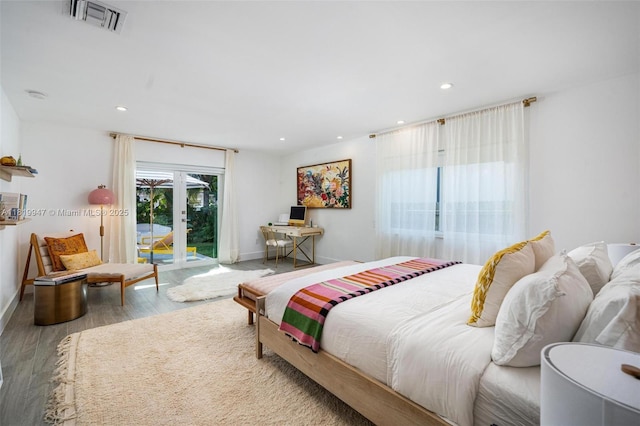 7755 Noremac Ave, Miami Beach, FL 33141 - bedroom featuring access to exterior, wood finished floors, recessed lighting, and french doors